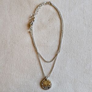 Silver Colored "Potential" Necklace with Gold Colored Shell Pendant